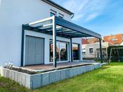 Wall-mounted patio with glass cover