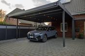 Freestanding carport with trapezoidal cover