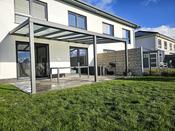 Wall-mounted patio with polycarbonate cover