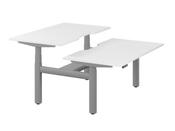 LEAP ELECTRONIC HEIGHT ADJUSTABLE TWIN BENCH DESK WITH SCALLOPED BACK, 1400MM X 800MM - WHITE TOP AND SILVER FRAME