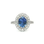 Oval Royal Blue Sapphire Halo Vintage Ring in 18ct White Gold with Natural Diamonds image