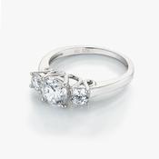 ring with plain band and 3 stones, centre one is bigger size 56 image