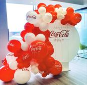 Circle Backdrop with half balloon arch draped around.
