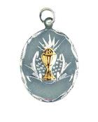 Silver oval disc with gold coloured chalice with chain. image