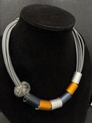 Corona grey rope style choker necklace with orange and grey cylindrical shaped beads