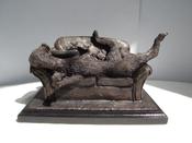 " Sofa Surfer " Irish wolfhound sculpture stretching on a sofa. image