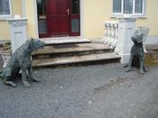 " Keeping The Wolf From The Door " pair of sitting wolves. image
