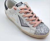 4B12 Supreme 310 trainer with silver and pink details