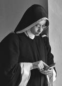 Nun with a phone image
