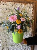 “Driving Miss Daisy” Zinc bucket containing fresh flowers and a car decoration in the flowers!