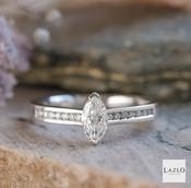 18kt White Gold Solitaire 0.55ct Marquise &amp; 0.14ct Channel Engagement Ring image