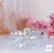 18kt White Gold Graduated SI G 0.34ct Five Stone 0.50ct Oval Centre Ring image