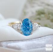 18kt Yellow Gold Platinum Oval 2.08ct Laboratory Blue Diamond &amp; Two Side Laboratory 0.72ct Pear Diamond Ring image