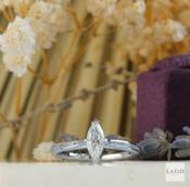 18kt White Gold 0.63ct Marquis Solitaire &amp; 0.09ct Channel Set Diamond Engagement Ring image