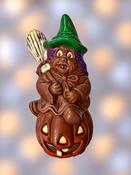 Scary Milk Chocolate Witch Sitting on Pumpkin image