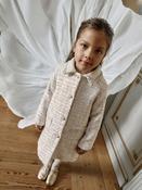 Elegant golden coat with pearl buttons image