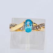 Oval Blue Stone Crossover Gold Ring