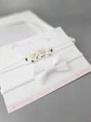 Dainty white flower headband and a white bow headband pack image