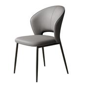 A sleek chair featuring a beige curved backrest and seat, complemented by slender black metal legs image