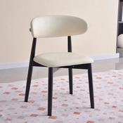 A stylish chair with a cream oval backrest and matching seat, set on contrasting black tapered legs