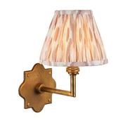 refined brass patina wall light with neutral ikat shade - Stillorgan Decor image