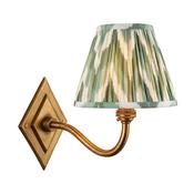 elegant brass patina curved arm wall light with Cotswold green zigzag patterned fabric shade - Stillorgan Decor image