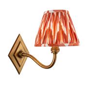 elegant brass patina curved arm wall light with apricot orange zigzag patterned fabric shade - Stillorgan Decor image