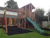 Deluxe Treehouse with Swings &amp; Slide image