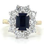 9ct Yellow Gold Laboratory Grown 2.20ct Emerald Cut Sapphire And 1.70ct Diamond Halo Ring