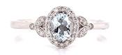 9ct White Gold 0.25ct Oval Aquamarine Castle Halo With Vintage 0.12ct Diamond Side Detail Ring image