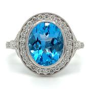 9ct White Gold 3.35ct Earth Grown Oval Cut Blue Topaz &amp; Diamond Halo Ring
