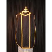 Black demask with gold braid