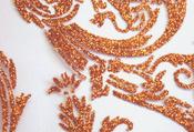 Orange glitter iron-on scroll on white net