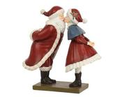 Santa and Mrs. Claus Kissing image