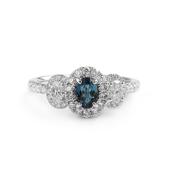 0.42ct Oval Green Tourmaline and Natural Diamond Halo Style Three Stone Ring in 18ct White Gold image