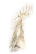 Gold coloured sitting reindeers