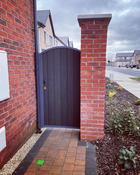 Arched metal framed side gate 