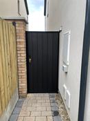 Metal framed side entrance gate.
