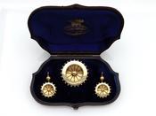1890s yellow gold and black enamel demi-parure image