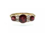 Victorian ruby and diamond three stone carved ring in gold image