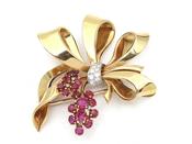 1950s diamond and ruby bow brooch in 18kt yellow gold image