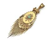 Antique emerald and seed pearl oval tassel locket in gold image