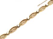 Late 19th Century French infinity bracelet in 18kt yellow gold with natural pearls image