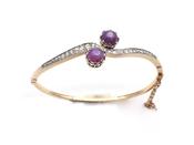 Antique two stone star ruby and diamond twist bangle in gold image