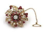 Retro diamond and ruby flower brooch in 18kt yellow gold image