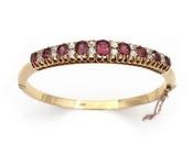 Antique ruby and diamond hinged bangle in yellow gold image