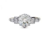 1950s 1.30ct round diamond solitaire with baguette shoulders in gold image