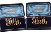 LATE VICTORIAN GOLD AND SEED-PEARL MONOGRAM BROOCHES, CIRCA 1890 image