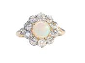 A Victorian cluster ring featuring a cabochon opal image