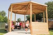 Gazebo with shiplap sides and shelf seating image
